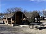 Two wooden cabins with a swing at BENSON KOA JOURNEY - thumbnail