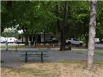 One of the gravel RV campsites with a picnic bench at HARRISBURG EAST CAMPGROUND & STORAGE - thumbnail