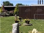 Flower pots and rocks at HARRISBURG EAST CAMPGROUND & STORAGE - thumbnail