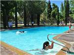 Kids swimming in pool at CASA DE FRUTA RV PARK - thumbnail