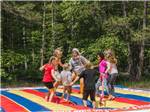 Kids jumping on the bounce pillow - thumbnail
