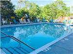 View larger image of Swimming pool with chaise lounges at ST CLOUDCLEARWATER RV PARK image #1