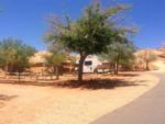 Trailer under a tree at GOULDING'S MONUMENT VALLEY CAMPGROUND & RV PARK - thumbnail
