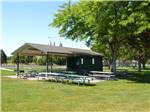 View larger image of An outdoor pavilion with picnic tables at BOARDMAN MARINA  RV PARK image #9