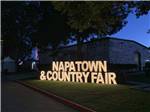 View larger image of The lit up front entrance sign at NAPA VALLEY EXPO RV PARK image #1