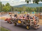People riding in the back of a truck at JELLYSTONE PARK AT NATURAL BRIDGE - thumbnail