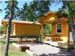 View larger image of Log cabins with decks at BADDECK CABOT TRAIL CAMPGROUND image #5