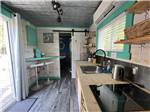 The kitchen area in one of the tiny houses at BADDECK CABOT TRAIL CAMPGROUND - thumbnail