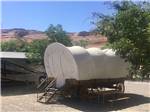 View larger image of Covered wagon next to RV at PAGE LAKE POWELL CAMPGROUND image #3