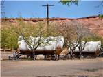 View larger image of A couple of rental covered wagons at PAGE LAKE POWELL CAMPGROUND image #4