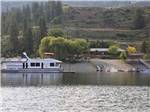 A ferry boat passing by the boat launch at LAKE ROOSEVELT NRA/KELLER FERRY CAMPGROUND - thumbnail