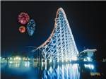 The amusement park at night with fireworks - thumbnail