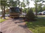 A motorhome in a shaded RV site - thumbnail