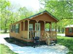 A rental cabin with porch and grill - thumbnail
