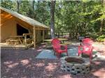 View larger image of A fire pit in front of one of the glamping tents at AVALON CAMPGROUND image #2
