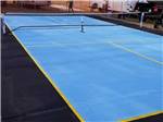 The blue pickleball court at CYPRESS CAMPGROUND & RV PARK - thumbnail
