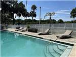 Lounge chairs by the pool - thumbnail