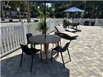 Tables and chairs in the pool area - thumbnail