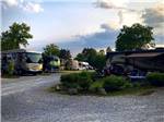 Motorhomes and trailers parked in gravel sites at KNOXVILLE CAMPGROUND - thumbnail