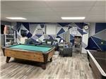 A pool table and air hockey in the rec room at KNOXVILLE CAMPGROUND - thumbnail