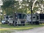 Class A RV with slide-outs and trailer in RV sites at Jamestown Campground - thumbnail