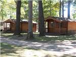 Two wooden cabins with decks at MANAPOGO PARK - thumbnail