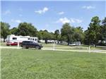 View larger image of A view of the gravel sites near a grassy area at SPARTANBURGCUNNINGHAM RV PARK image #2