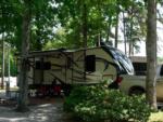 RV parked with patio seating at Pine Ridge Campground - thumbnail