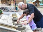 Playing with a sand table at JELLYSTONE PARK ESTES - thumbnail