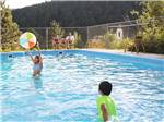 Kids playing in a pool at JELLYSTONE PARK ESTES - thumbnail