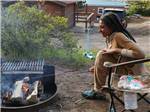 A girl roasting marshmallows at JELLYSTONE PARK ESTES - thumbnail