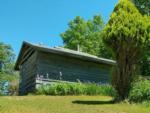 Uphill view of a wooden building at COLALUCA FAMILY CAMPGROUND - thumbnail