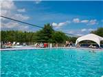 People lounging around the pool - thumbnail