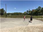 Two people playing basketball at CAPE COD'S MAPLE PARK CAMPGROUND & RV PARK - thumbnail