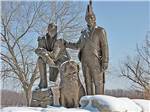 Statue of two soldiers and a dog at SUNDERMEIER RV PARK - thumbnail