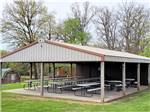The pavilion with picnic benches at PERRYVILLE RV RESORT BY RJOURNEY - thumbnail