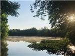 The lake with mist above the water at PERRYVILLE RV RESORT BY RJOURNEY - thumbnail
