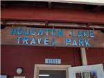 The campground name above the office sign at HOUGHTON LAKE TRAVEL PARK CAMPGROUND - thumbnail
