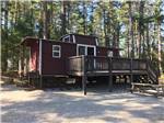 One of the rental cabins with a deck at NATURES CAMPSITES - thumbnail