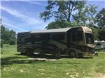 RV in the grass at Cherokee Park Campground - thumbnail