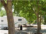 A fifth wheel trailer in a RV site at WRIGHT'S DESERT GOLD MOTEL & RV PARK - thumbnail