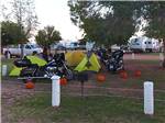 Motorcycles parked in the tent sites at VAN HORN RV PARK - thumbnail