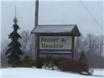 The front entrance sign in snow at BEAVER MEADOW FAMILY CAMPGROUND - thumbnail