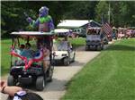 View larger image of People doing a golf cart parade at BEAVER MEADOW FAMILY CAMPGROUND image #6