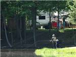 An adult and child fishing at BEAVER MEADOW FAMILY CAMPGROUND - thumbnail