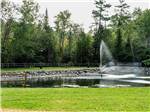 View larger image of The fountain in the middle of the lake at REST N NEST CAMPGROUND image #1