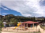 View larger image of Playground with swing set at SPRUCE LAKE RV RESORT image #6