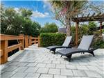 View larger image of Lounge chairs in beautifully landscaped area at NORTHTIDE NAPLES RV RESORT image #2