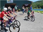 View larger image of Kids riding their bikes at TWIN OAKS CAMPGROUND image #8