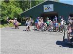 View larger image of Kids getting ready to ride their bikes at TWIN OAKS CAMPGROUND image #9